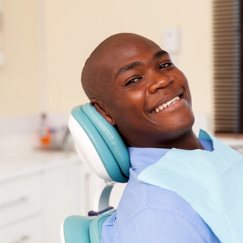 man sitting in dental chair