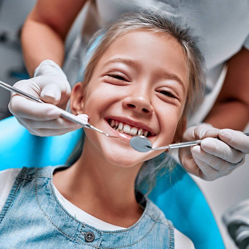 young girl getting a dental cleaning