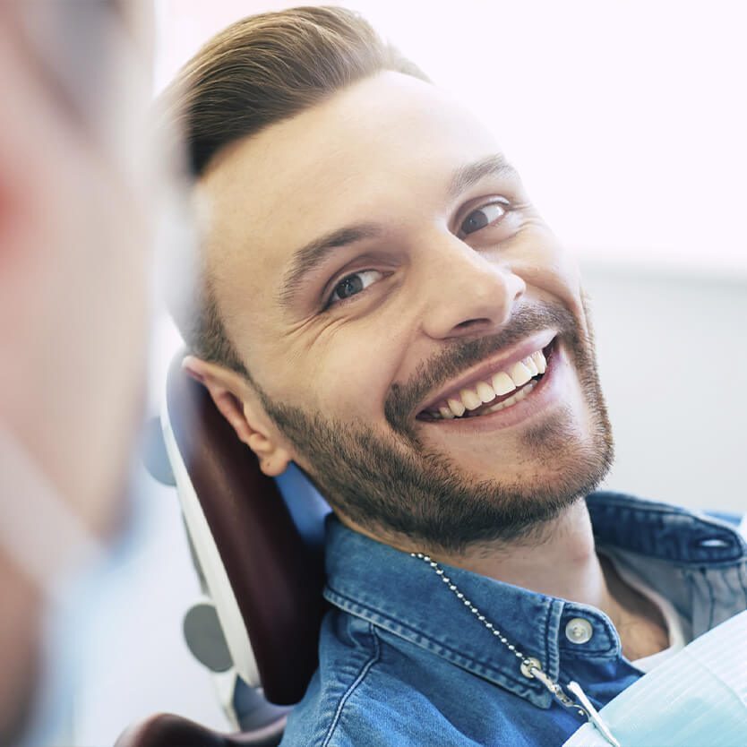 man smiling after dental cleaning