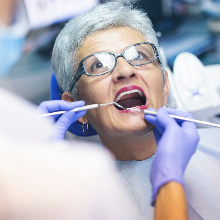 older woman getting dental work